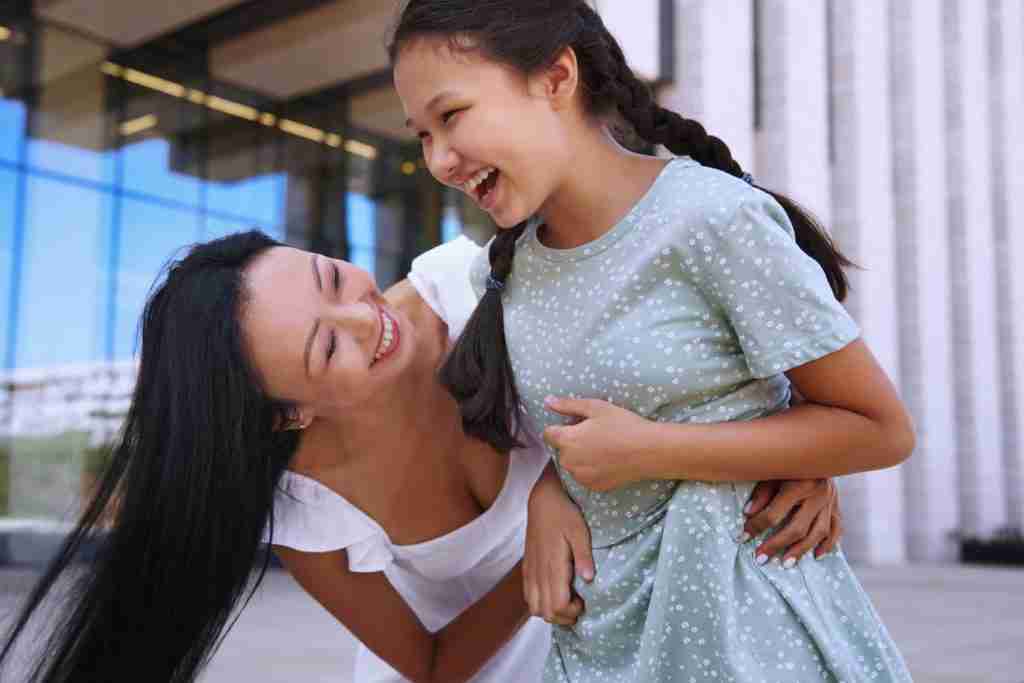 woman smiling with daughter