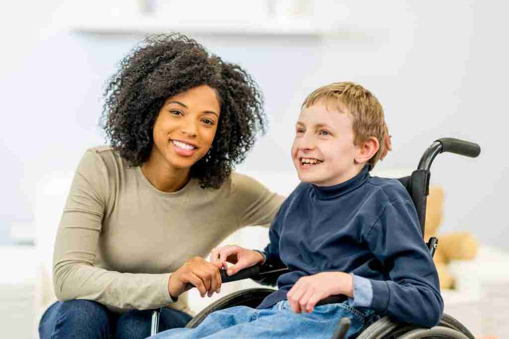 woman with autistic individual sitting on a wheelchair