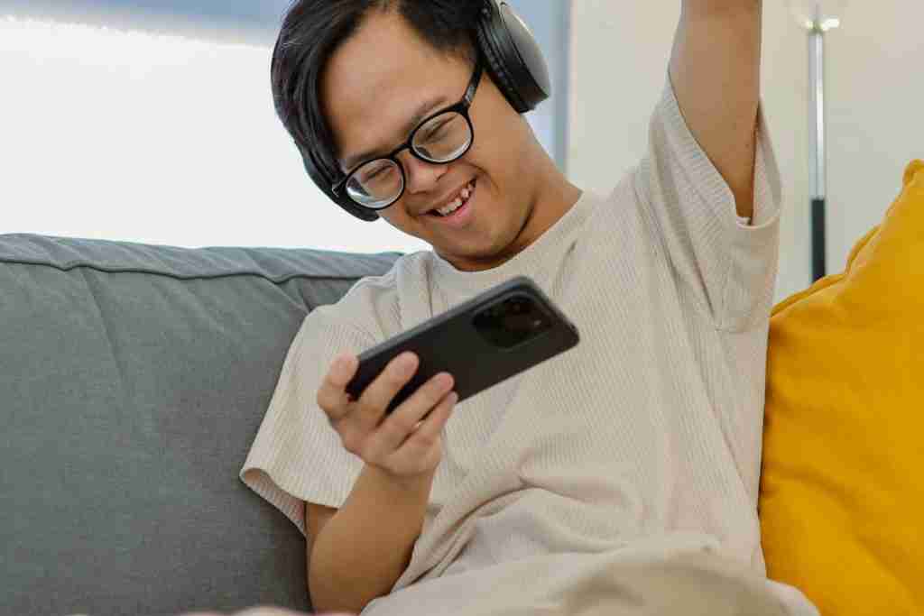 an autistic person holding phone
