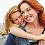 woman smiling with daughter