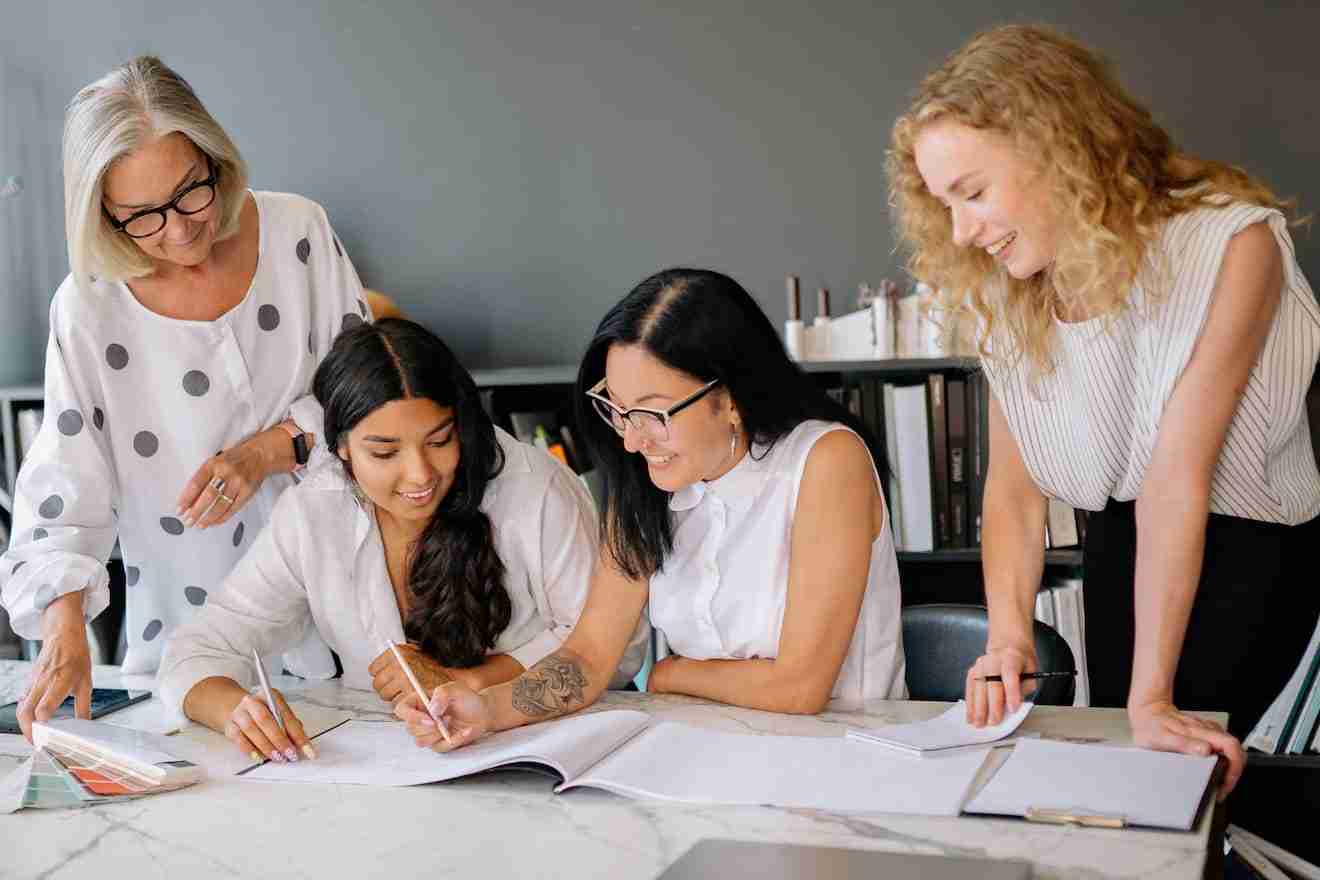 group of professional women doing office work