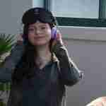 smiling woman with headphones on