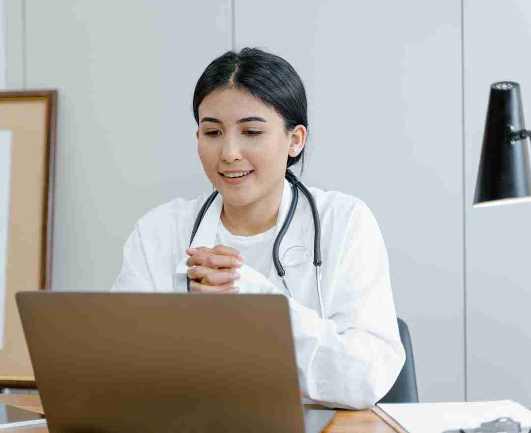 telehealth expert using laptop