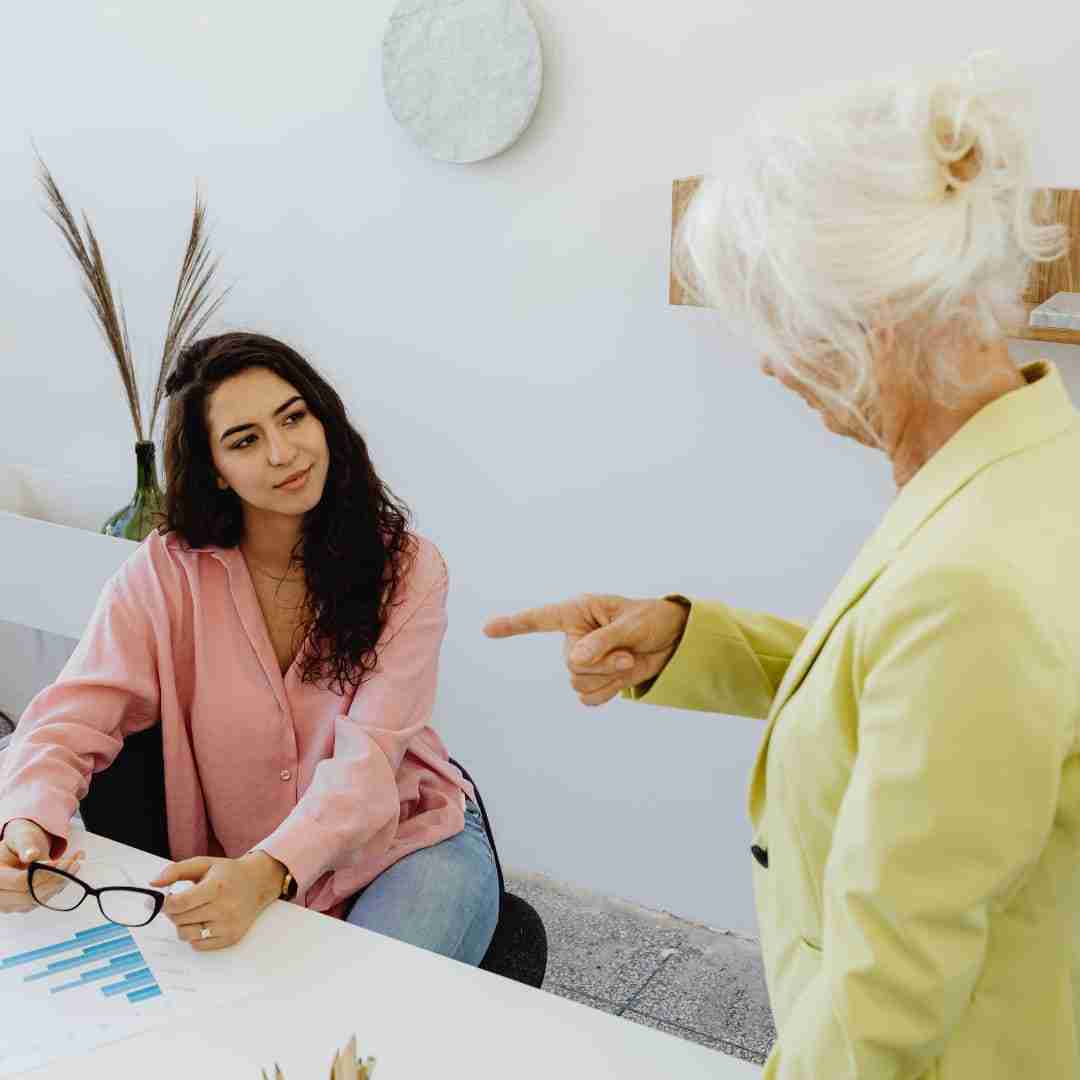 woman talking to elderly