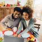 happy couple using laptop