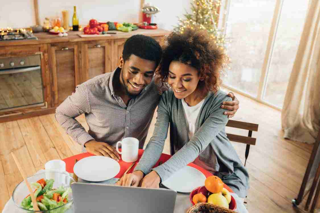 happy couple using laptop