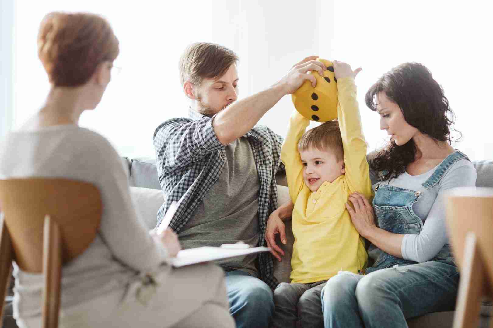 family with child in therapy session